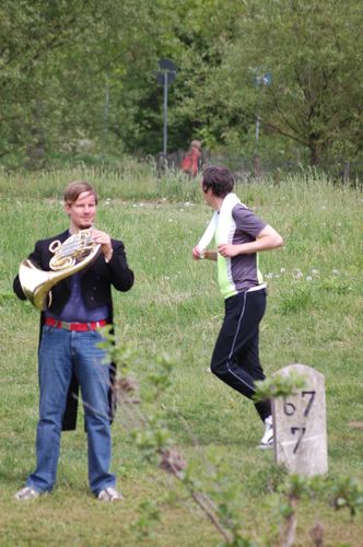 photo showing a moment from the piece “Schwalbe”, which was performed on and by a small river