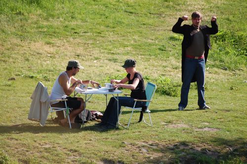 photo showing a moment from the piece “Schwalbe”, which was performed on and by a small river