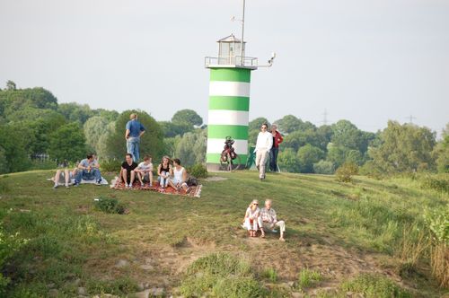 photo showing a moment from the piece “Schwalbe”, which was performed on and by a small river