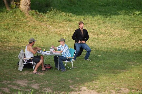 photo showing a moment from the piece “Schwalbe”, which was performed on and by a small river