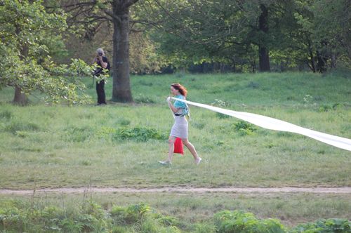 photo showing a moment from the piece “Schwalbe”, which was performed on and by a small river