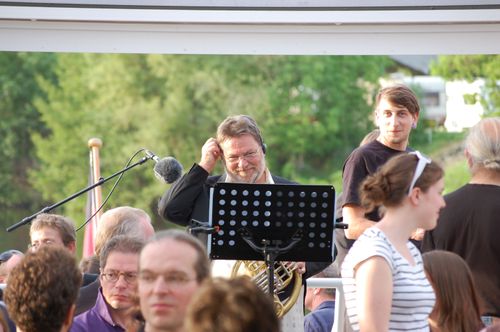 photo showing a moment from the piece “Schwalbe”, which was performed on and by a small river