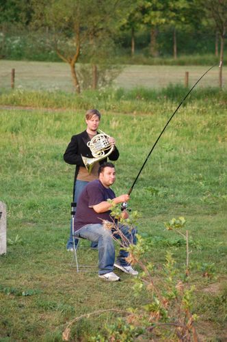 photo showing a moment from the piece “Schwalbe”, which was performed on and by a small river