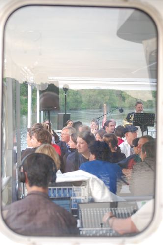 photo showing a moment from the piece “Schwalbe”, which was performed on and by a small river