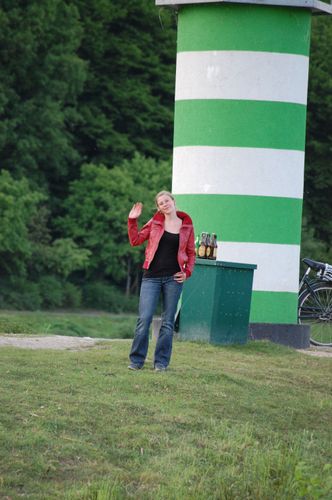 photo showing a moment from the piece “Schwalbe”, which was performed on and by a small river