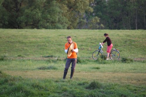 photo showing a moment from the piece “Schwalbe”, which was performed on and by a small river