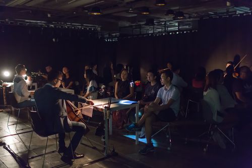 picture showing a moment from Manos Tsangaris' piece “Love & Diversity” in Hong Kong