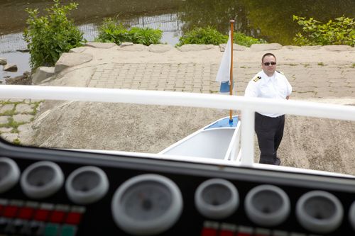 photo showing a moment from the piece “Schwalbe”, which was performed on and by a small river
