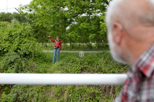 photo showing a moment from the piece “Schwalbe”, which was performed on and by a small river