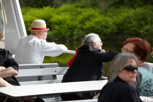 photo showing a moment from the piece “Schwalbe”, which was performed on and by a small river